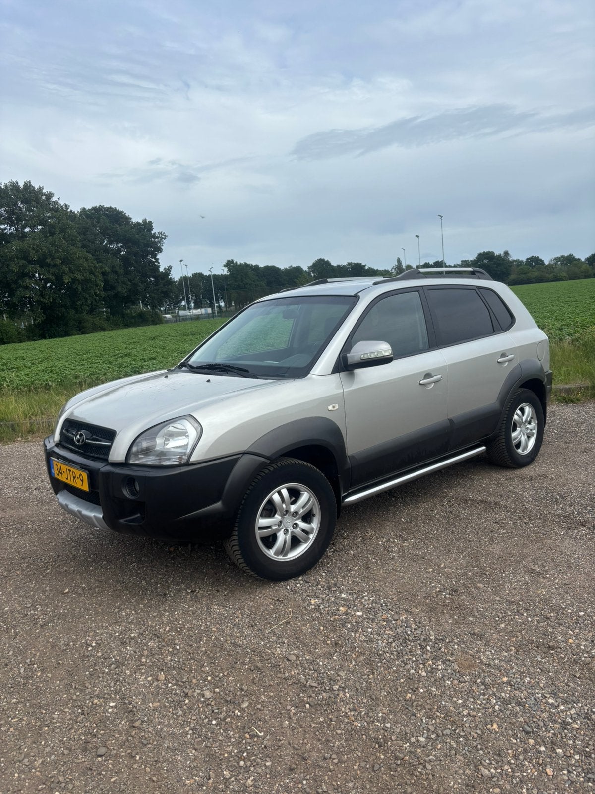 Hyundai Tucson 2.0 I 2WD 2009 Grijs, Auto's, 4 cilinders, Origineel Nederlands, 75 €/maand, Handgeschakeld