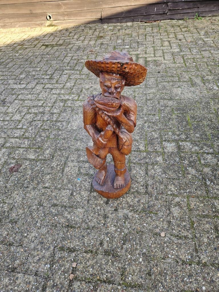 Houten beeld, Ophalen