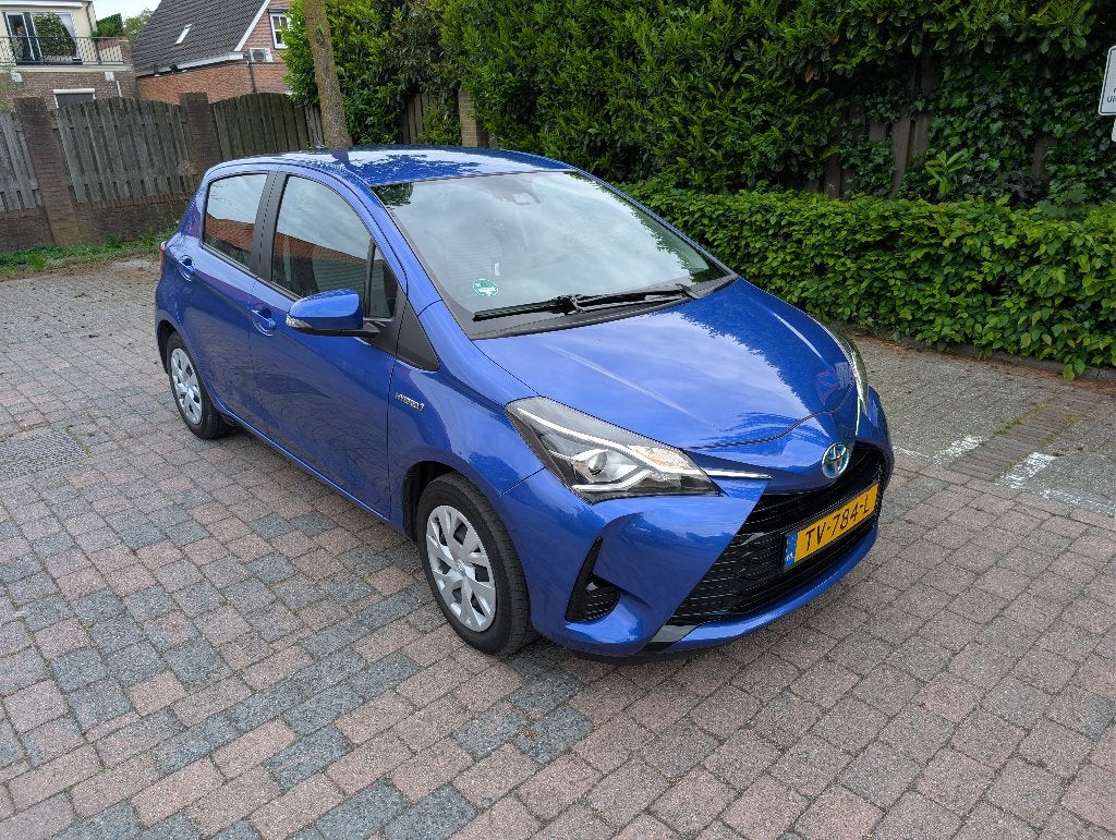 Toyota Yaris 1.5 Hybrid 100pk 5D CVT 2018 Blauw, 40 €/maand, Beige, 4 cilinders, Origineel Nederlands