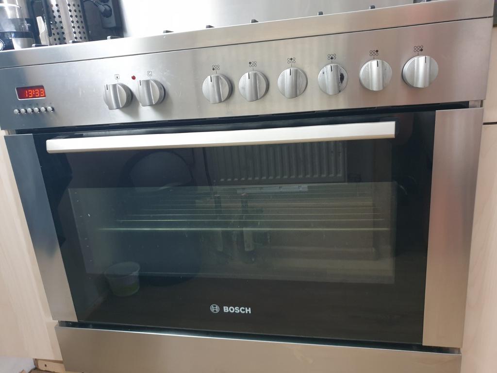 Bosch vrijstaand rvs 6pits gasfornuis met wokbrander en oven, Ophalen, Vrijstaand, Gas