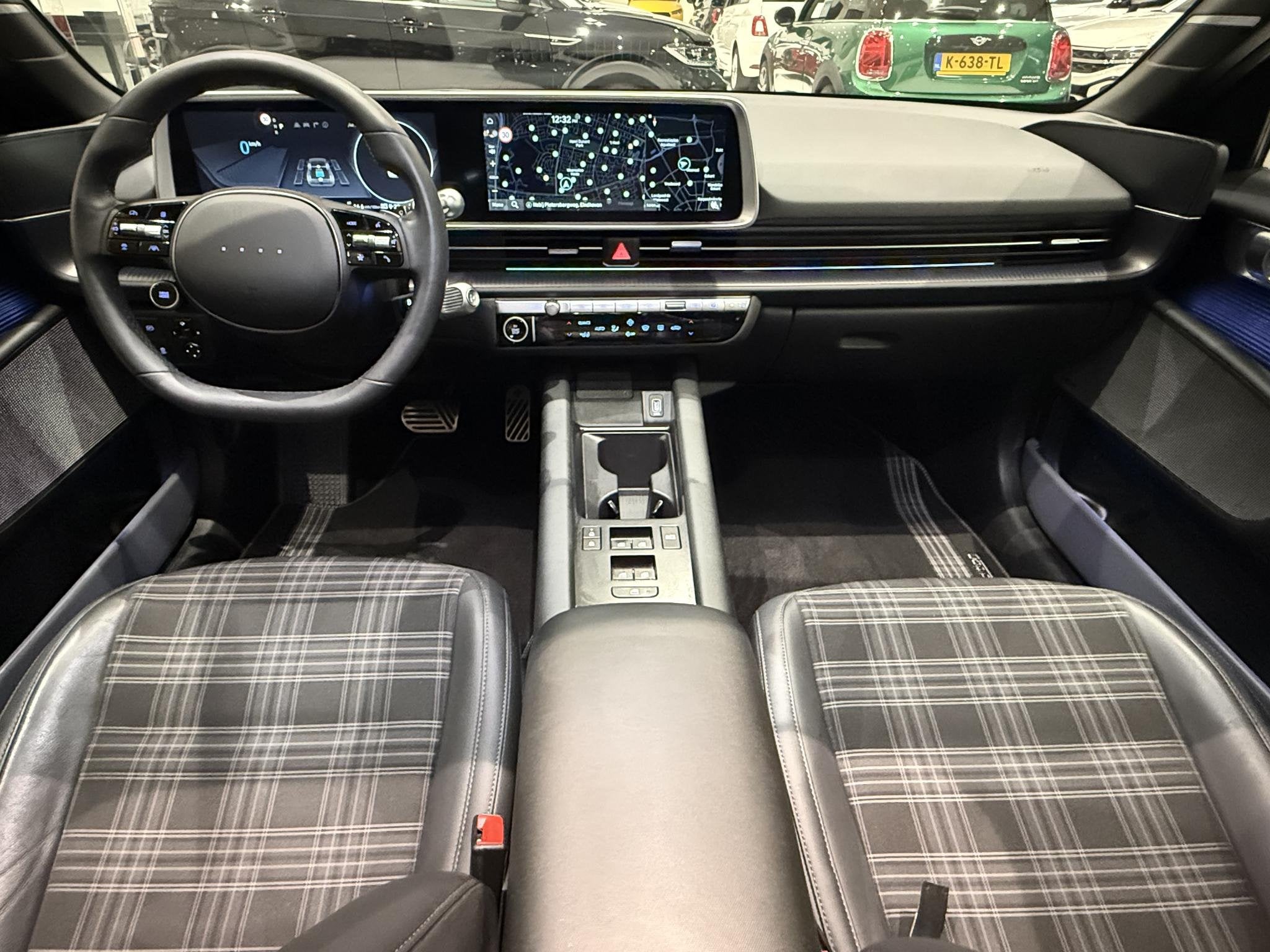 Hyundai IONIQ 6 First Edition AWD 77.4 kWh | Schuifdak | Tre, Auto's, Gebruikt, Blauw, Leder en Stof, Origineel Nederlands