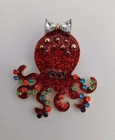 Goudkleurige broche inktvis rood met strikje, Ophalen of Verzenden, Nieuw, Rood, Overige materialen