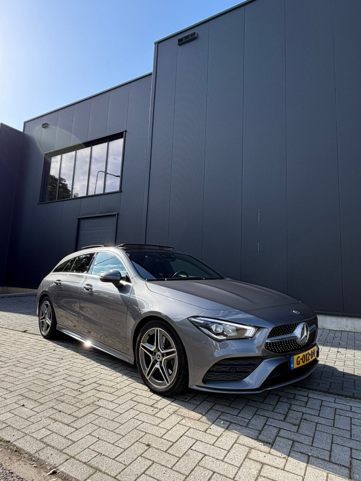 Mercedes-Benz CLA 200 shooting Brake AMG Line, Zwart, 4 cilinders, Leder en Stof, 163 pk