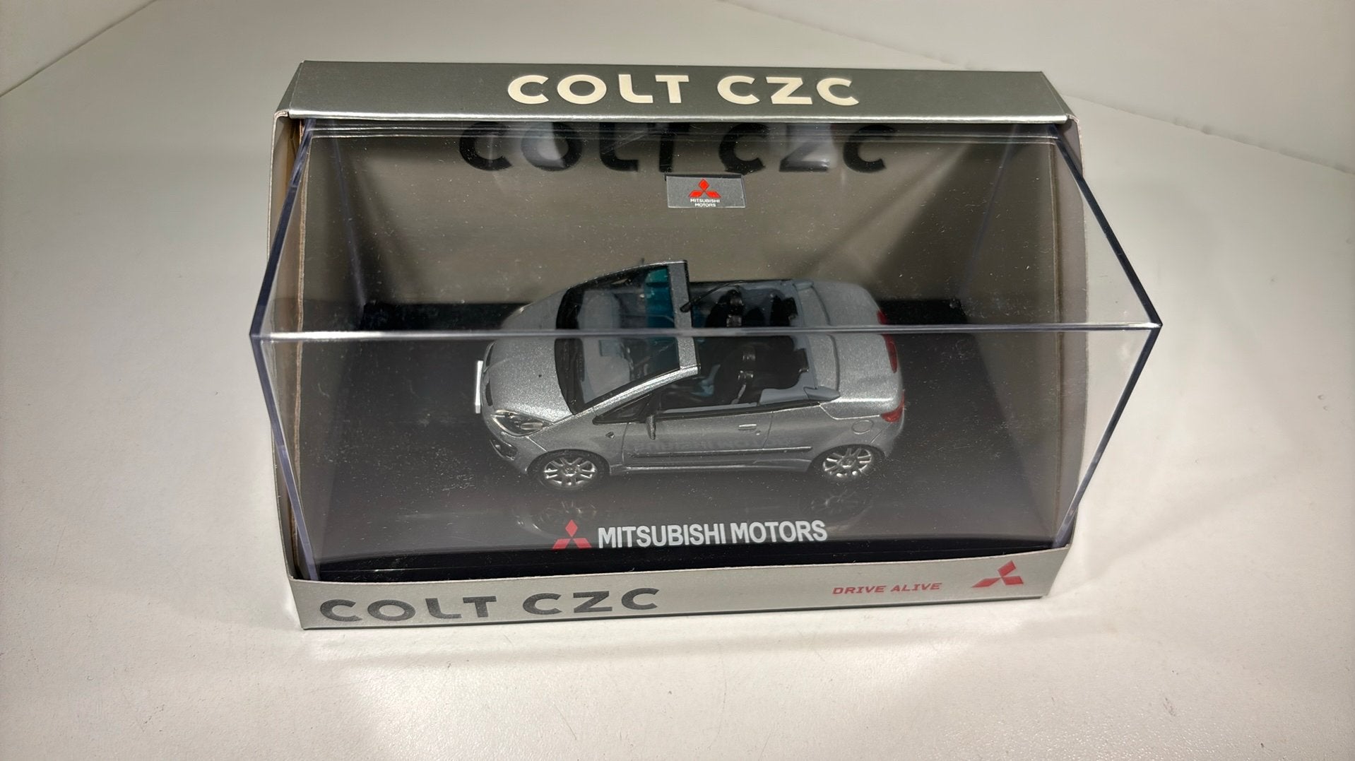 Mitsubishi colt czc silver sun star 1.43, Hobby en Vrije tijd, Modelauto's | 1:43, Overige merken, Auto, Ophalen of Verzenden