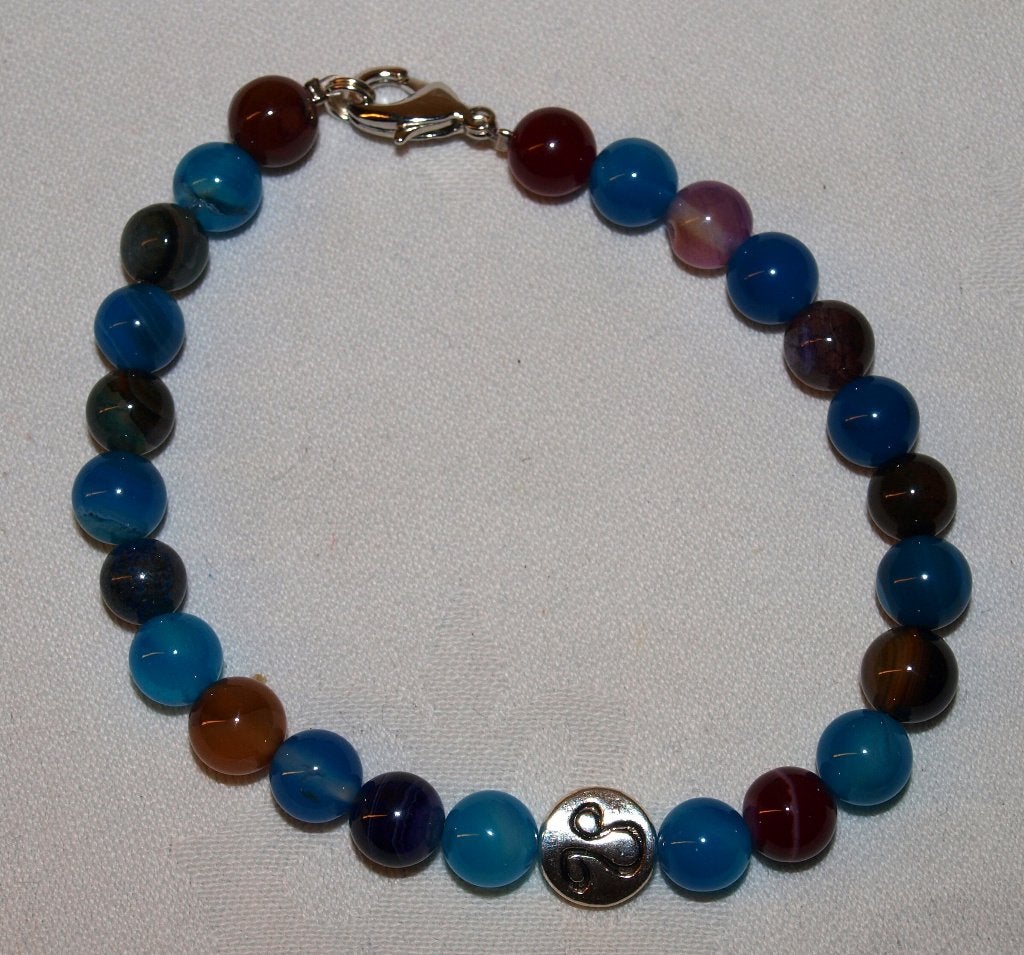 Kleurrijke kralenarmband met zilverkleurige bedel leeuw, Overige materialen, Overige kleuren, Nieuw, Ophalen of Verzenden