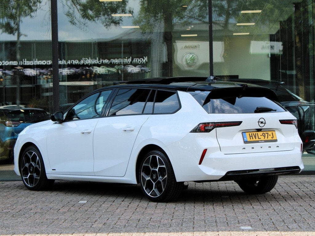 Opel Astra Sports Tourer 1.2 Turbo Ultimate | Navi / Panoram, Auto's, 12 maanden, Euro 6, 1199 cc, Wit