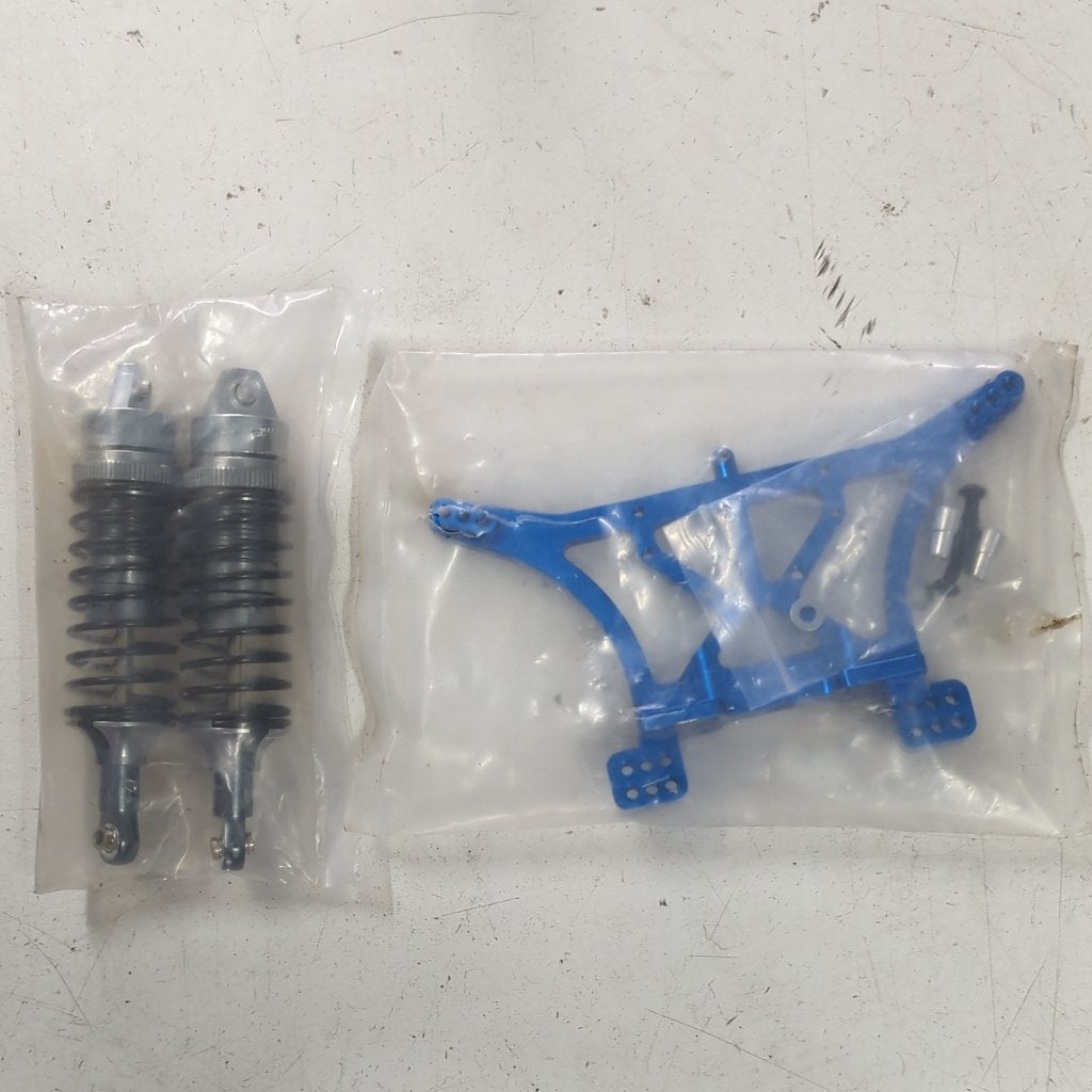 Traxxas 2wd aluminium shocktower & shocks (Slash, Rustler), Hobby en Vrije tijd, Modelbouw | Radiografisch | Auto's, Ophalen of Verzenden
