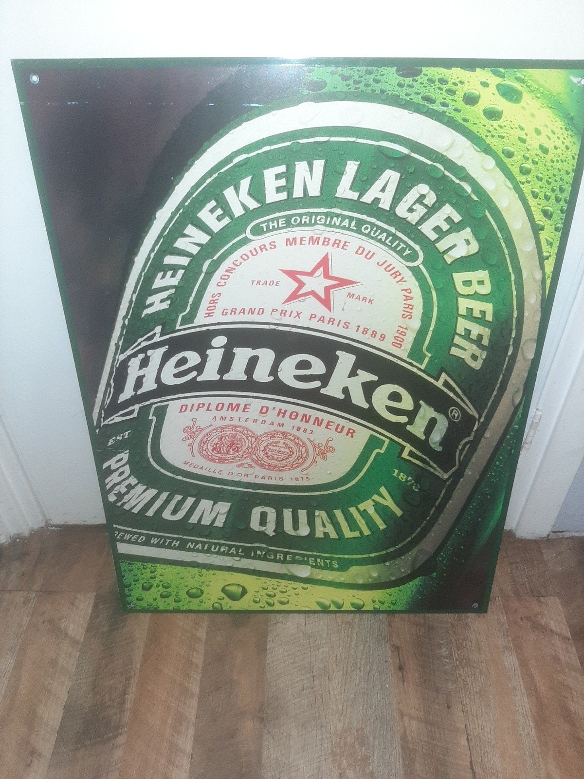 Metalen reclame bord heineken, Ophalen