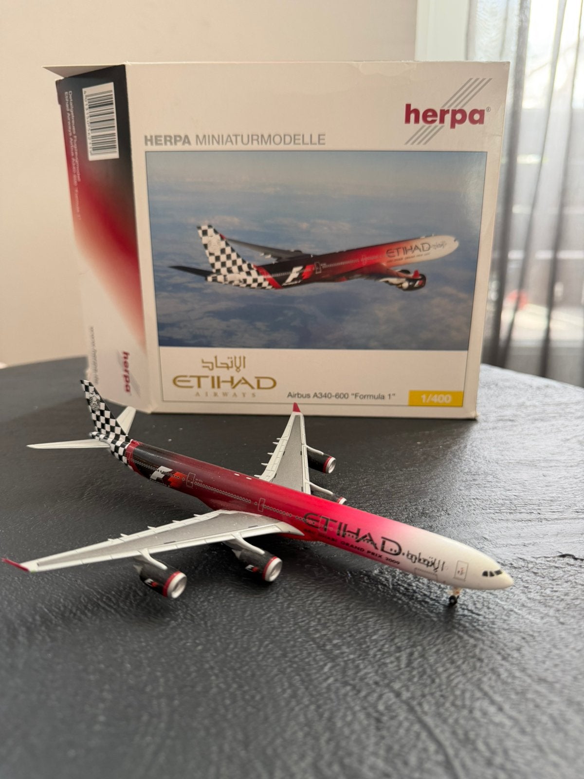 Herpa Wings 1:400 Etihad Airways Airbus A340-600 "Formula 1", Ophalen of Verzenden, Zo goed als nieuw, Schaalmodel