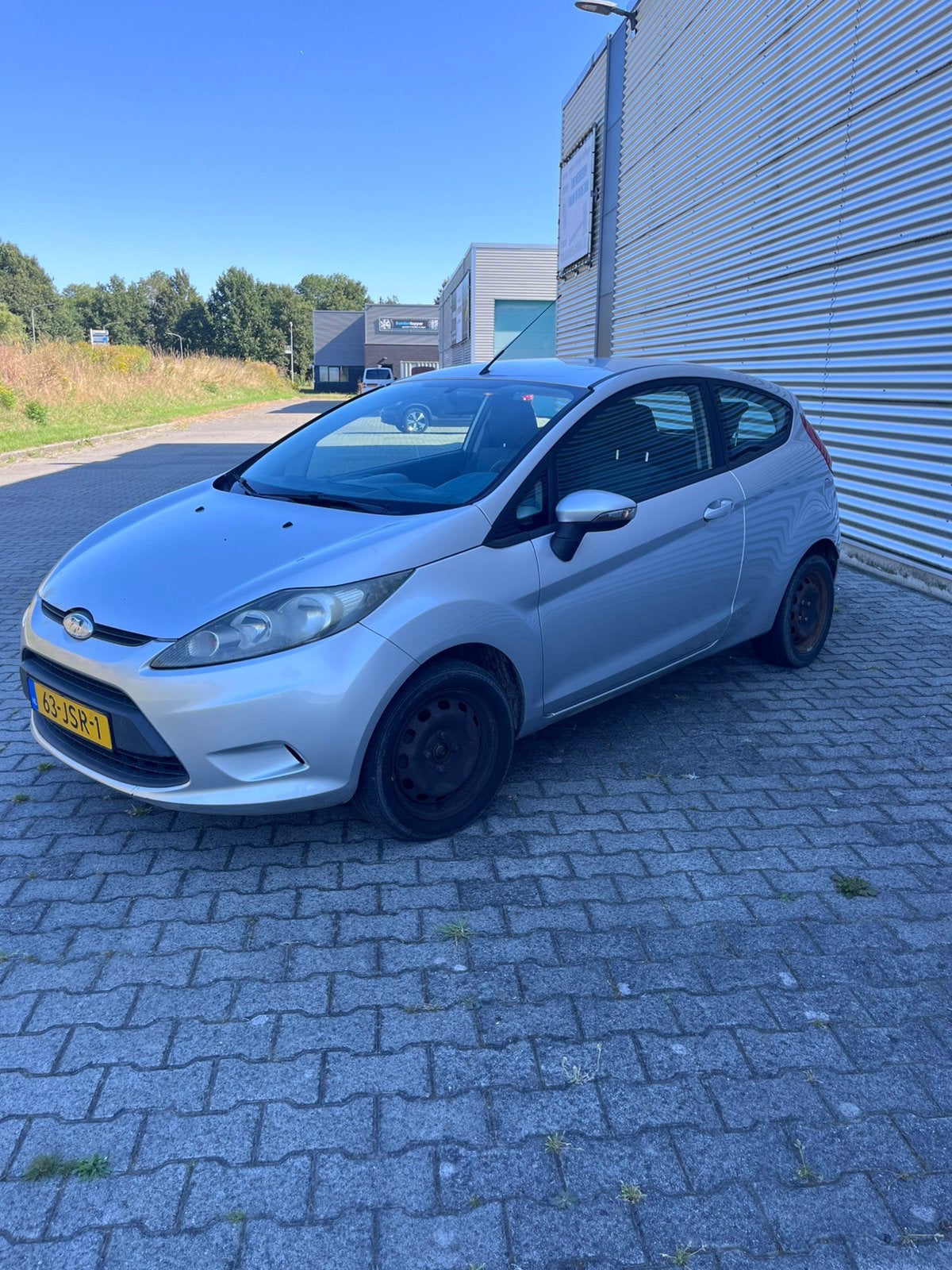 Ford Fiësta 1.25 44KW 3DR 2009 Grijs, Auto's, Ford, Voorwielaandrijving, 4 cilinders, Origineel Nederlands, Handgeschakeld