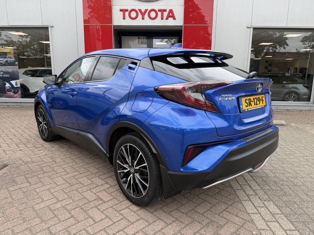 Toyota C-HR 1.8 Hybrid Style Premium Pack, Auto's, Euro 6, 4 cilinders, Blauw, Leder en Stof