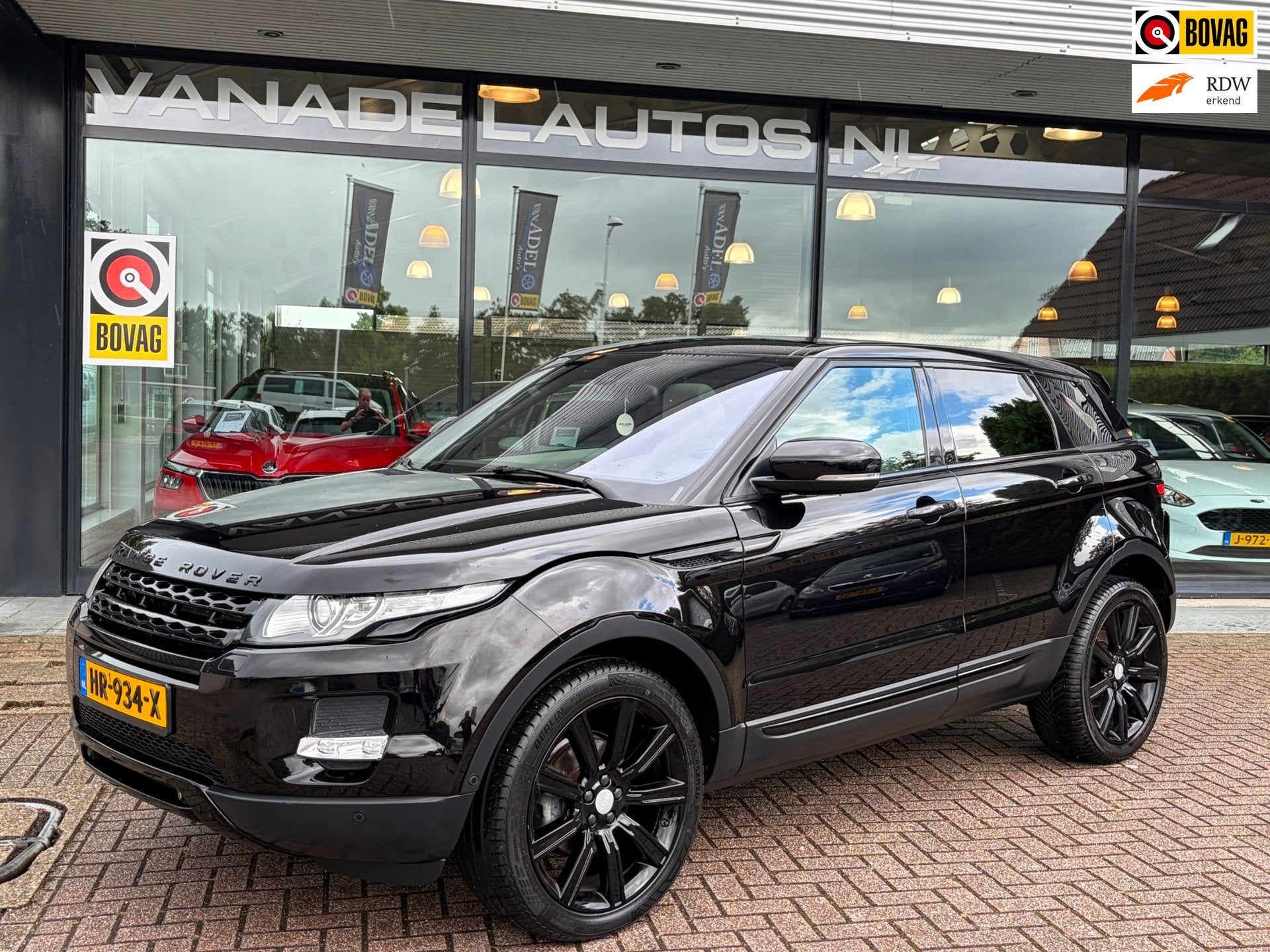 Land Rover Range Rover Evoque 2.0 Si 4WD Prestige Panorama L, Auto's, Automaat, Euro 5, 4 cilinders, Zwart