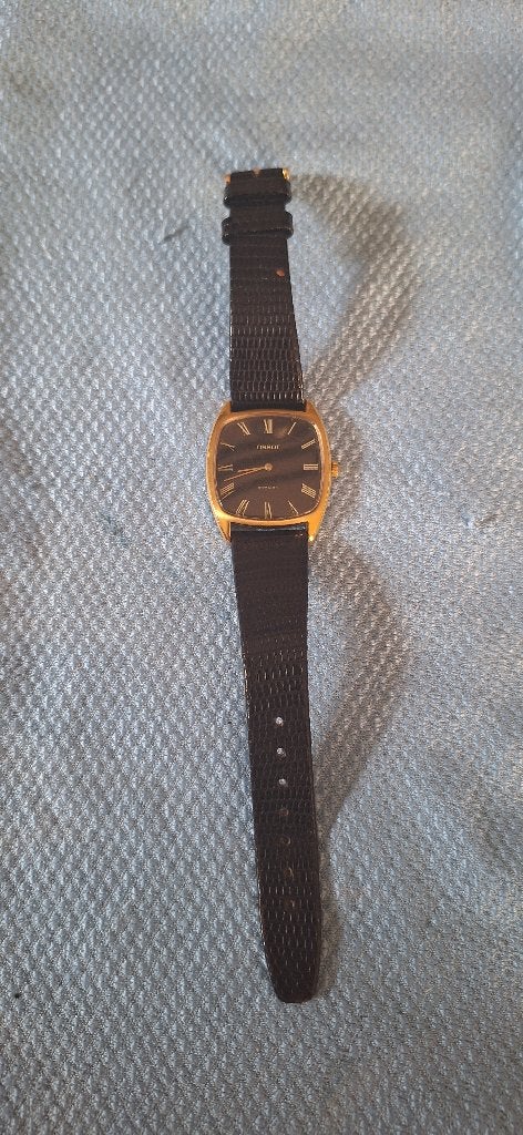 Tissot Stylist horloge met zwarte wijzerplaat, Ophalen, Overige materialen, Tissot, 1960 of later