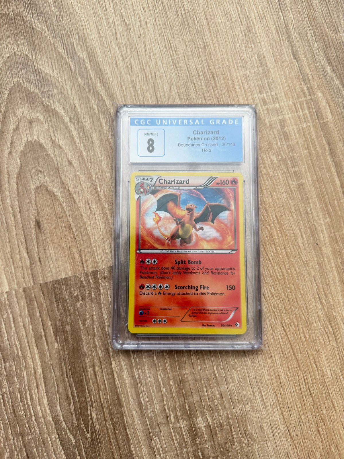 Charizard Pokémon Kaart (2012) CGC Universal Grade 8, Ophalen of Verzenden, Zo goed als nieuw, Losse kaart