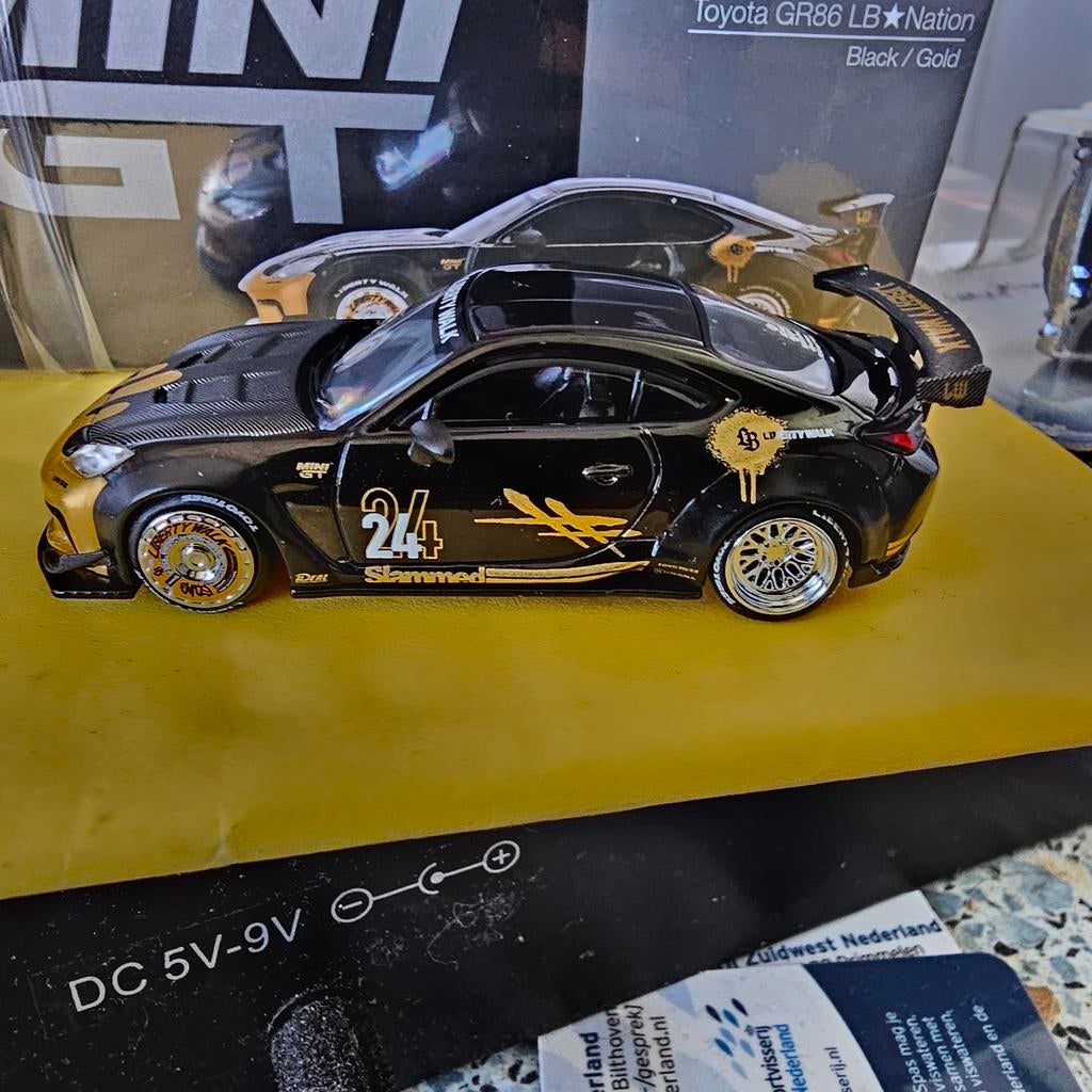 Mini GT Toyota GR86 LBNation Zwart/Goud Modelauto, Niet gespecificeerd, algemeen modelautomerk, Nieuw, Ophalen of Verzenden, Niet gespecificeerd