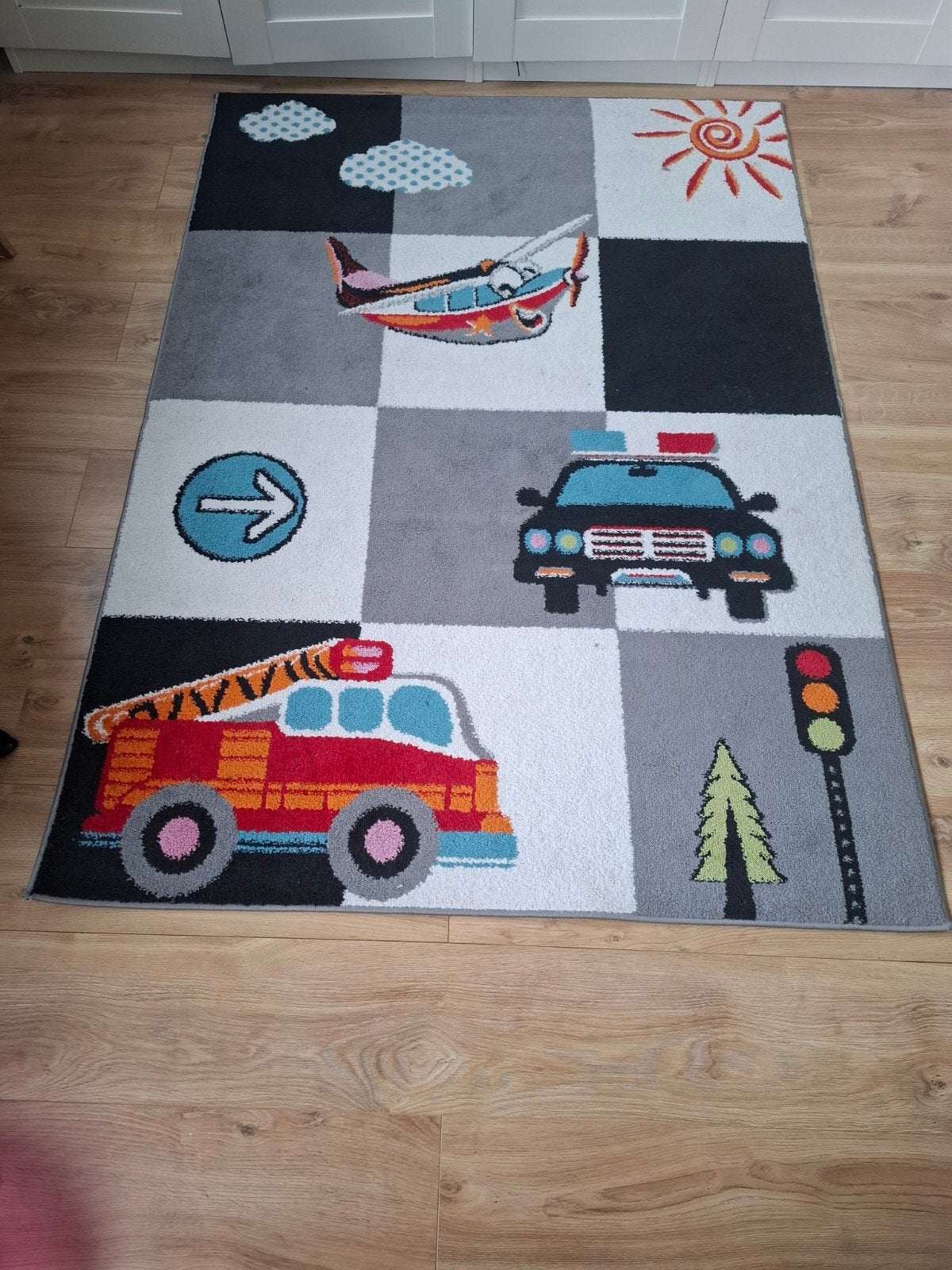 Vloerkleed met brandweer/politie, Ophalen
