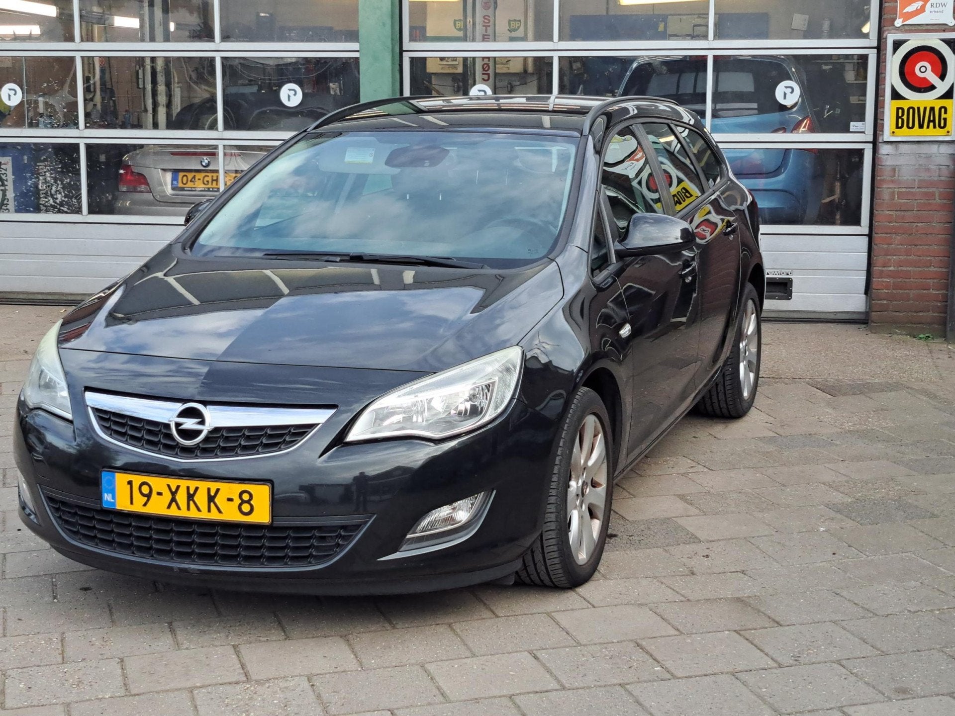 Opel Astra Sports Tourer 1.4 Turbo Edition (bj 2012), Auto's, Euro 5, Stof, Gebruikt, Zwart