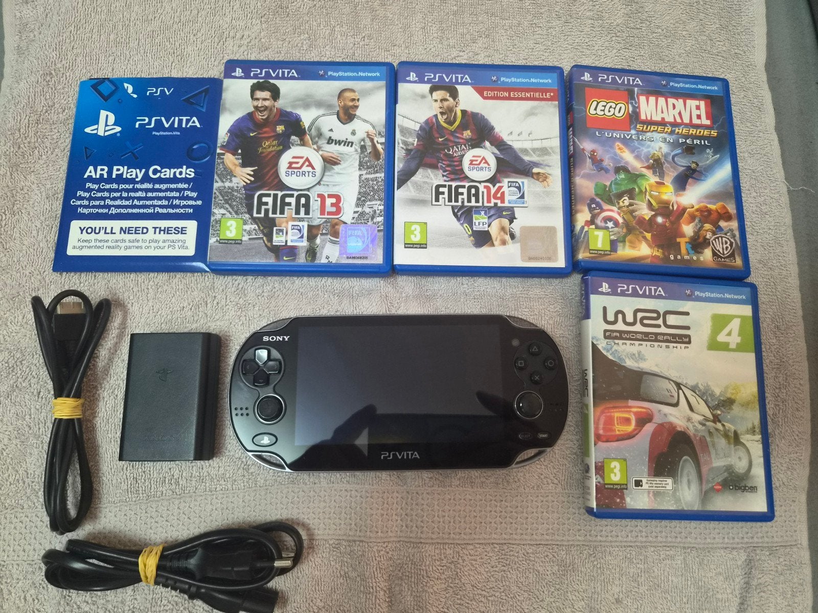 Sony PlayStation Vita OLED PCH-1004 met 4 games, Spelcomputers en Games, Ophalen of Verzenden, Gebruikt, Zwart, Met games