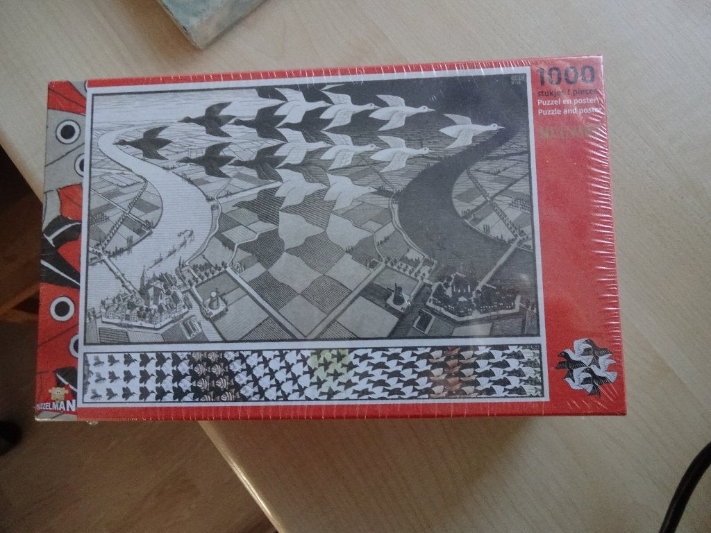 M.C Escher [ 1000 stukjes] nieuw Dag en nacht., Ophalen of Verzenden, 500 t/m 1500 stukjes, Nieuw