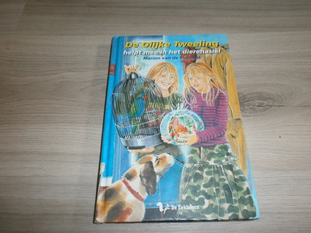 Boek: De olijke tweeling - helpt mee in de dierenasiel, Boeken, Ophalen of Verzenden, Gelezen, Marion van de Coolwijk