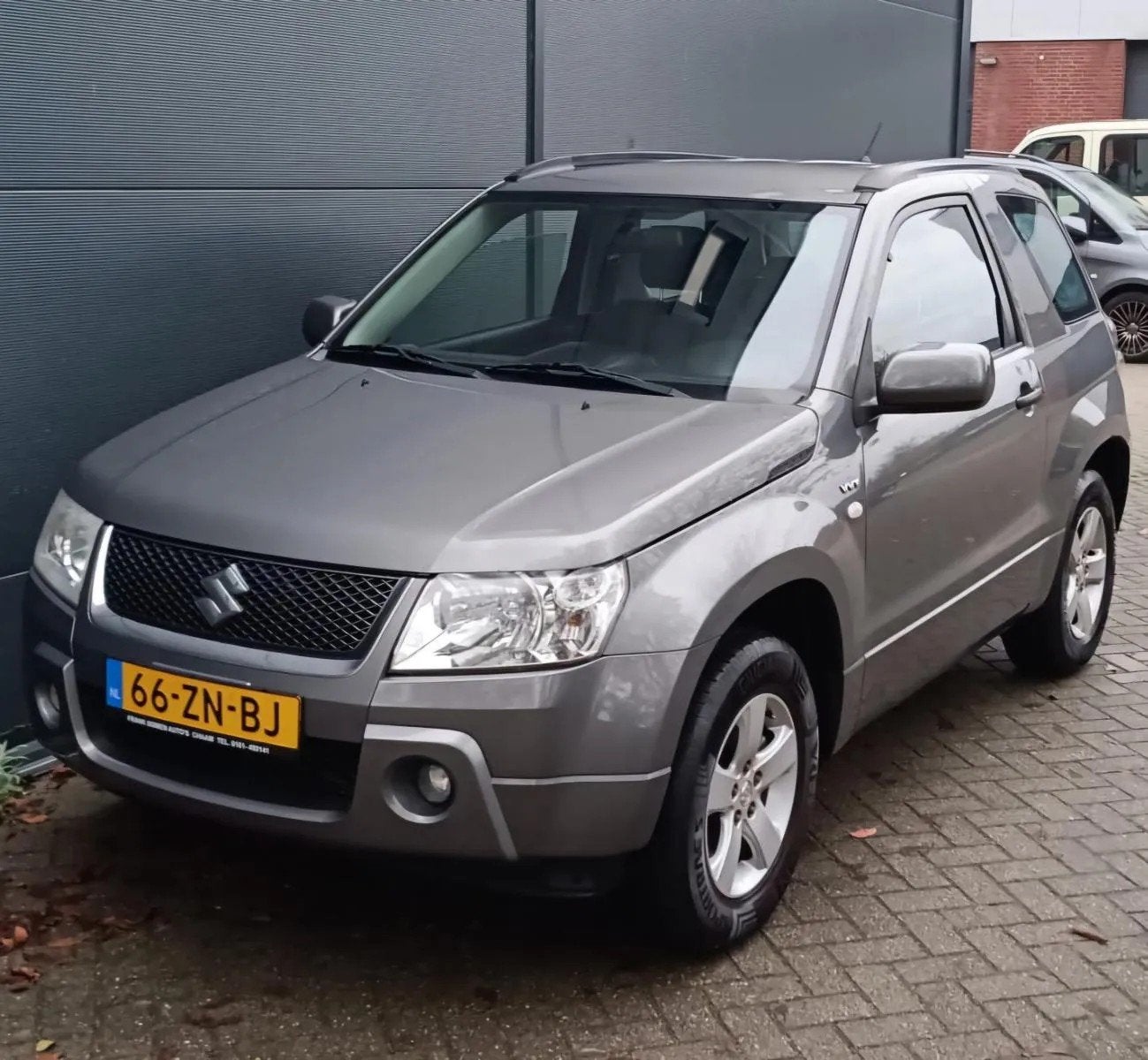Suzuki Grand Vitara 1.6 16V Exclusive, Auto's, 1345 kg, Stof, Gebruikt, Zwart