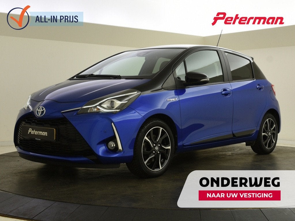 Toyota Yaris 1.5 Hybrid Bi-Tone | PDC | Navigatie |, Auto's, Gebruikt, Euro 6, Blauw, 100 pk