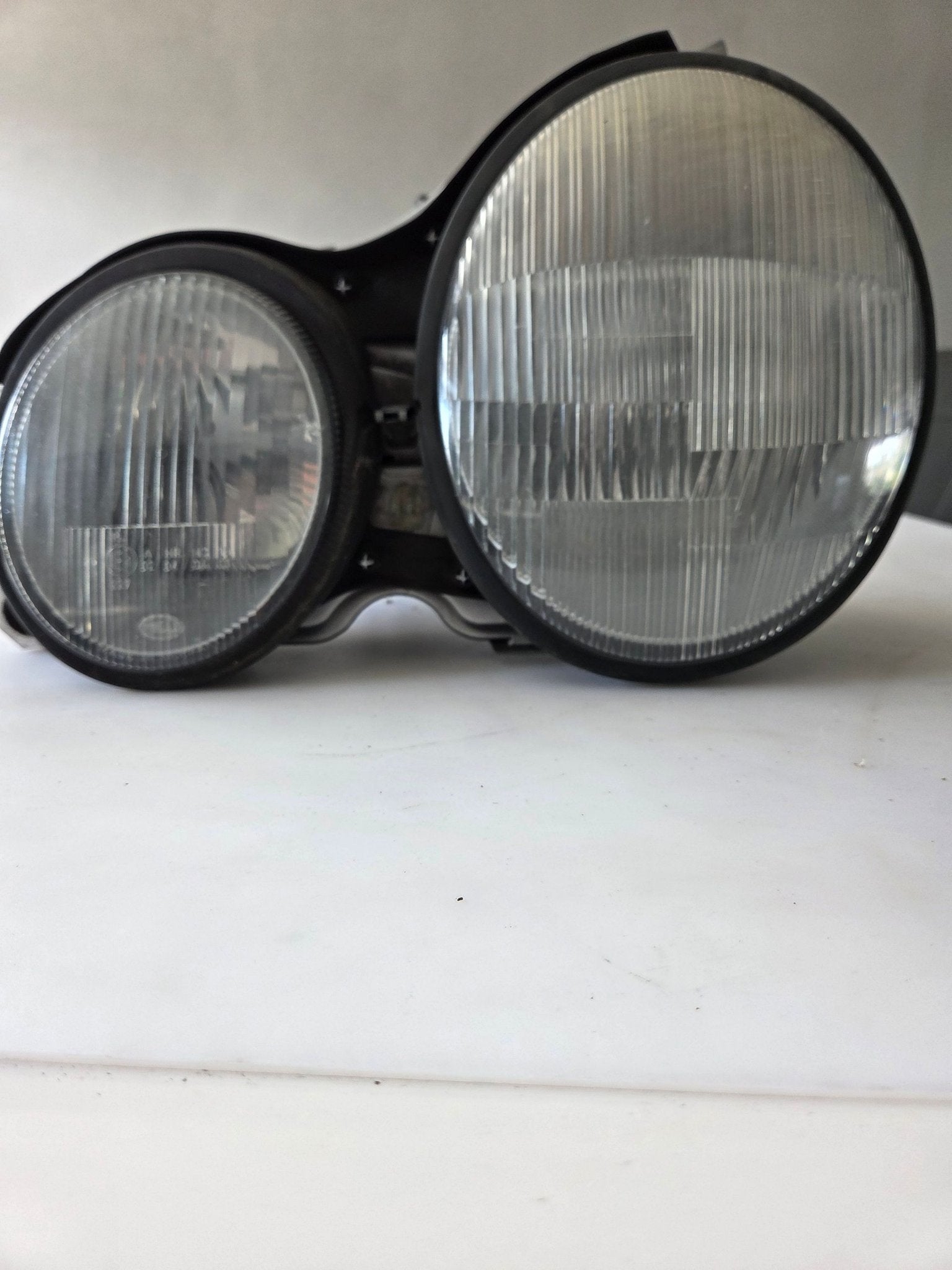 Koplamp Mercedes E-Klasse W210 Links, Gebruikt, -, Ophalen of Verzenden, Hella