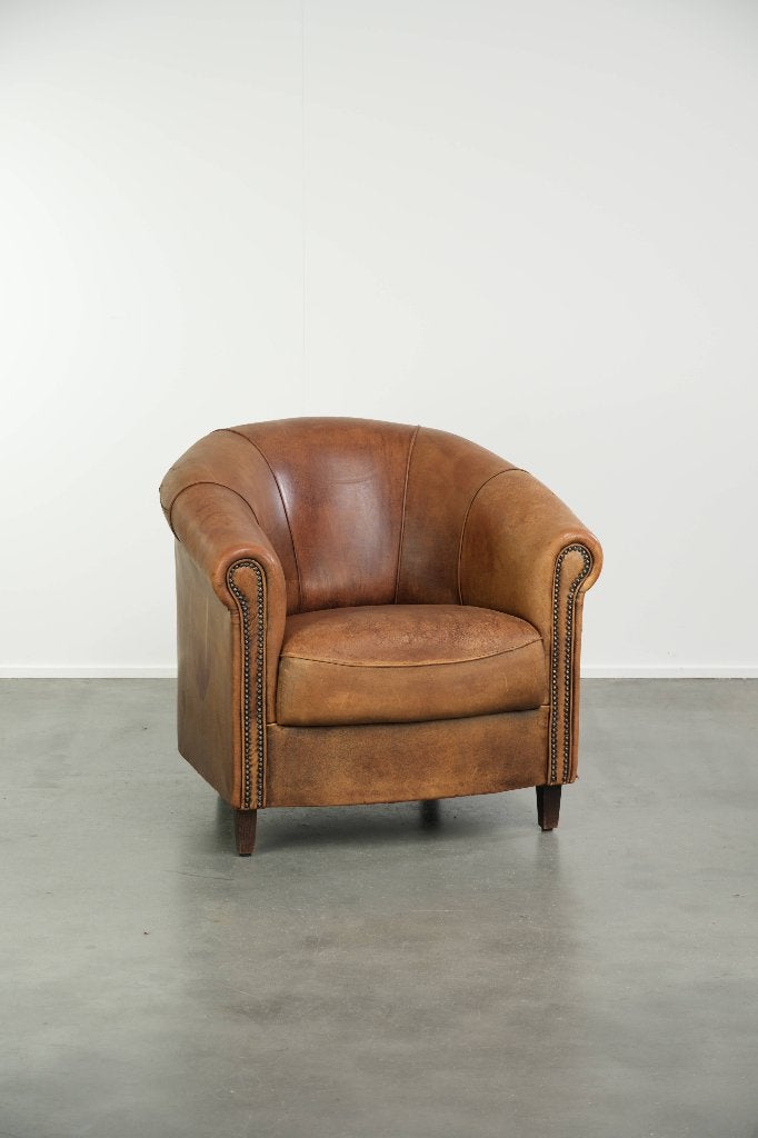 Geleefde schapenleren clubfauteuil met een mooi patina, Huis en Inrichting, Ophalen, Gebruikt, Vintage, /