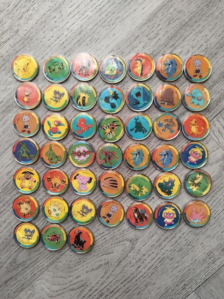 Vintage Pokémon munten / pogs uit 2001, Hobby en Vrije tijd, Verzamelkaartspellen | Pokémon, Ophalen of Verzenden, Gebruikt, Overige typen