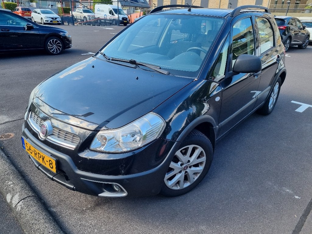 Fiat Sedici 1.6 16V 2WD 2011 Zwart, Auto's, Voorwielaandrijving, Euro 5, Stof, Zwart