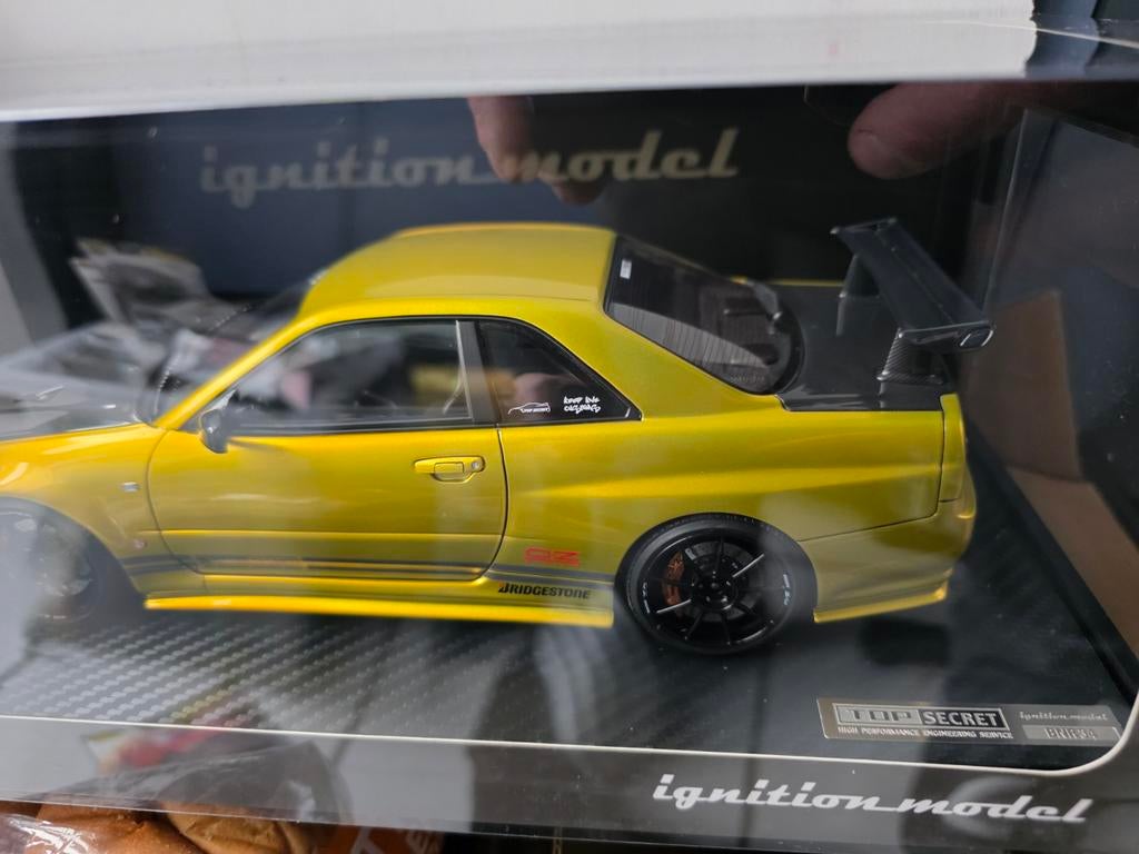 Ignition Model Nissan Skyline GT-R R34 Top Secret Gold, Hobby en Vrije tijd, Modelauto's | 1:18, Overige merken, Auto, Onbekend