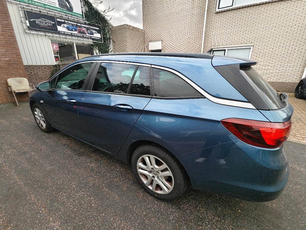 Opel Astra 1.4 Turbo 110KW Sports Tourer AT 2016 Blauw, Auto's, Stof, 750 kg, 4 cilinders, Blauw