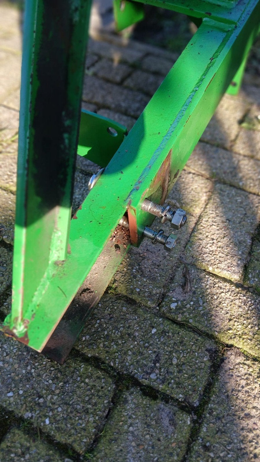 John Deere voorlader met bak, Ophalen