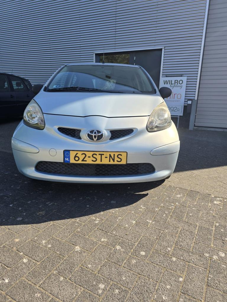 Toyota Aygo 1.0 12V Vvt-i 5DRS 2006 Blauw, Auto's, Toyota, Voorwielaandrijving, Stof, Zwart, 68 pk