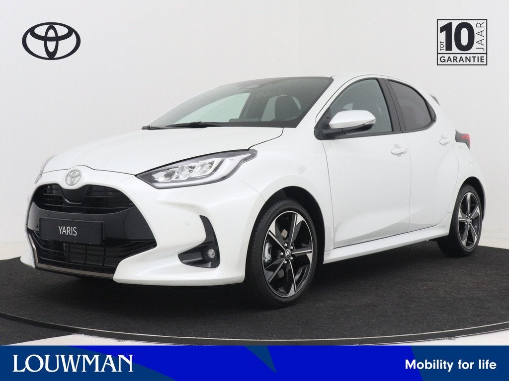 Toyota Yaris 1.5 Hybrid 130 Executive (bj 2025, automaat), Auto's, Toyota, 12 maanden, 450 kg, Wit, Automatische klimaatregeling