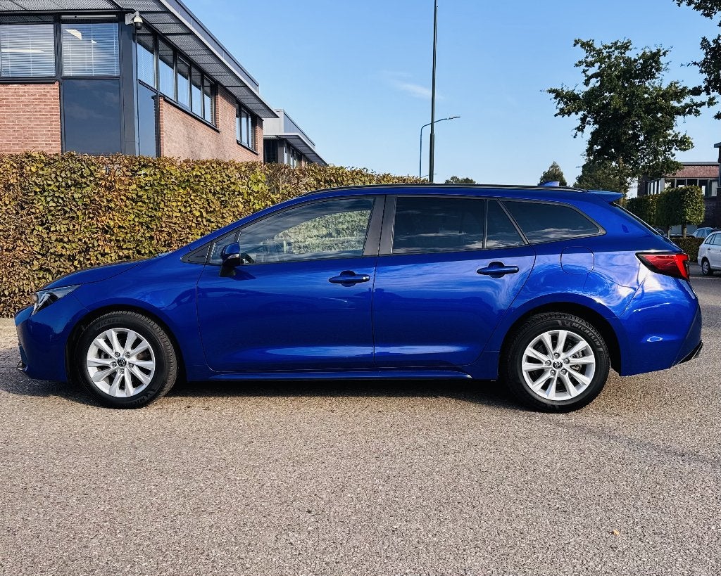 Toyota Corolla TS Hybrid 140 Business | FACELIFT, Auto's, 4 cilinders, Blauw, Corolla, Hybride Elektrisch/Benzine