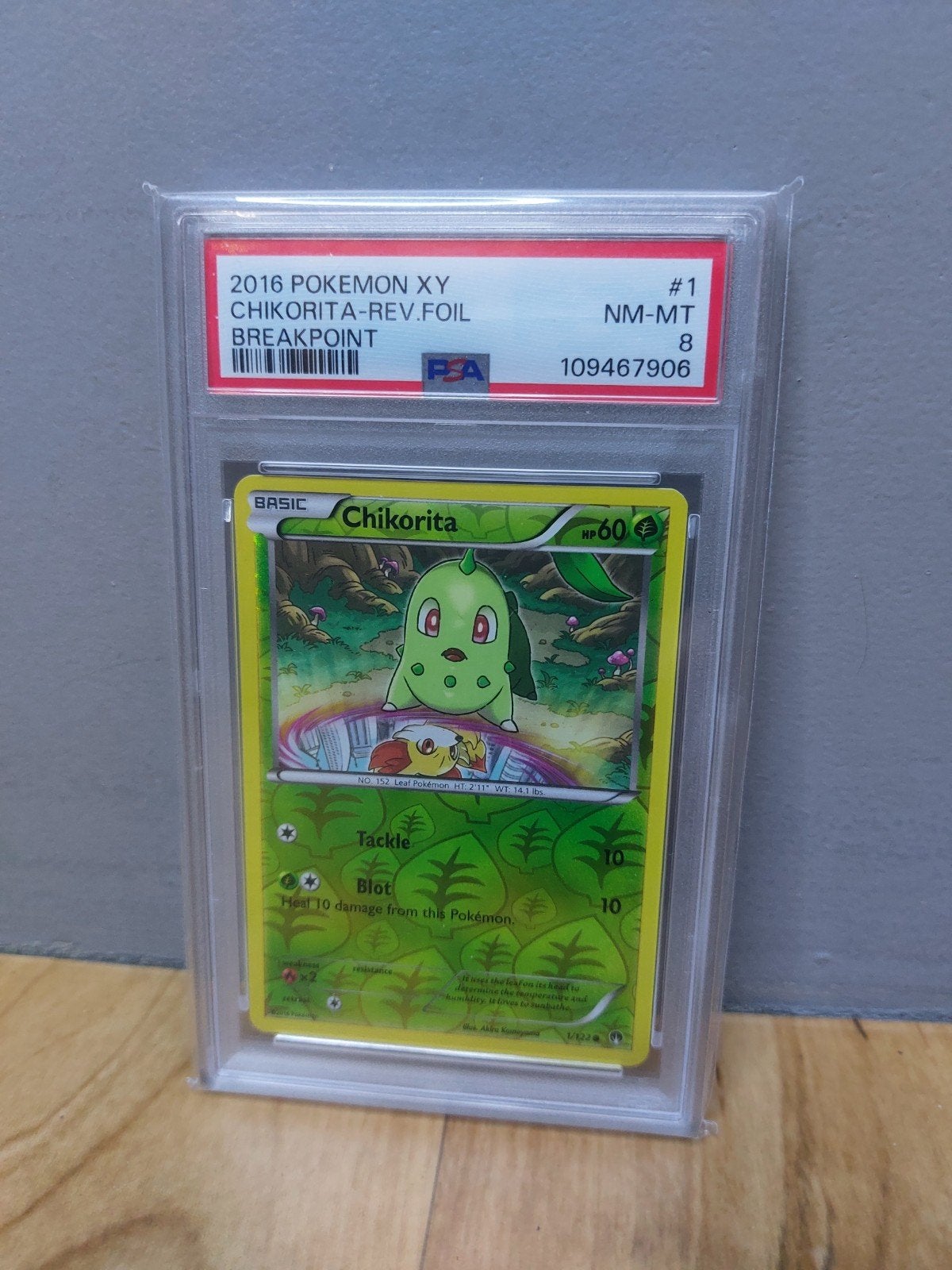 Chikorita PSA 8 (Pokémon) 1/122 Breakpoint 2016 Reverse Holo, Ophalen of Verzenden, Zo goed als nieuw
