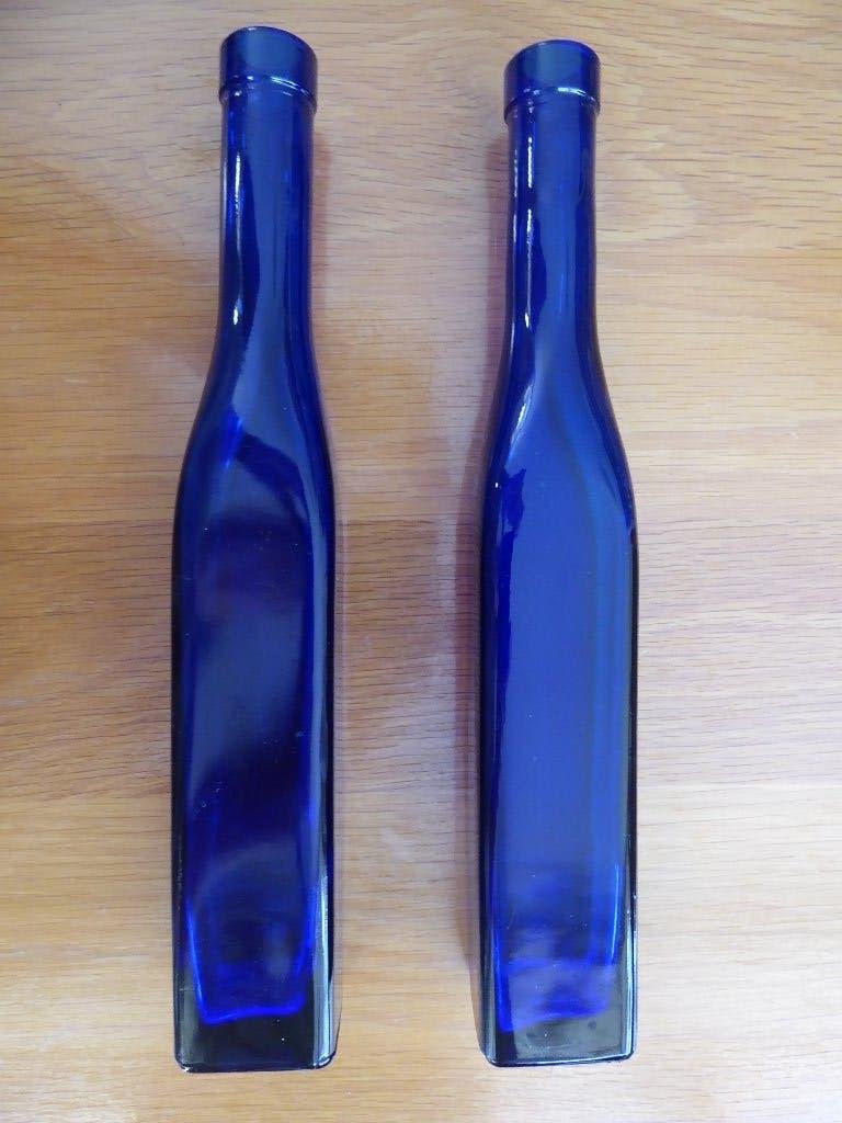 2x blauwe flessen, Ophalen of Verzenden, Zo goed als nieuw, Blauw, Glas