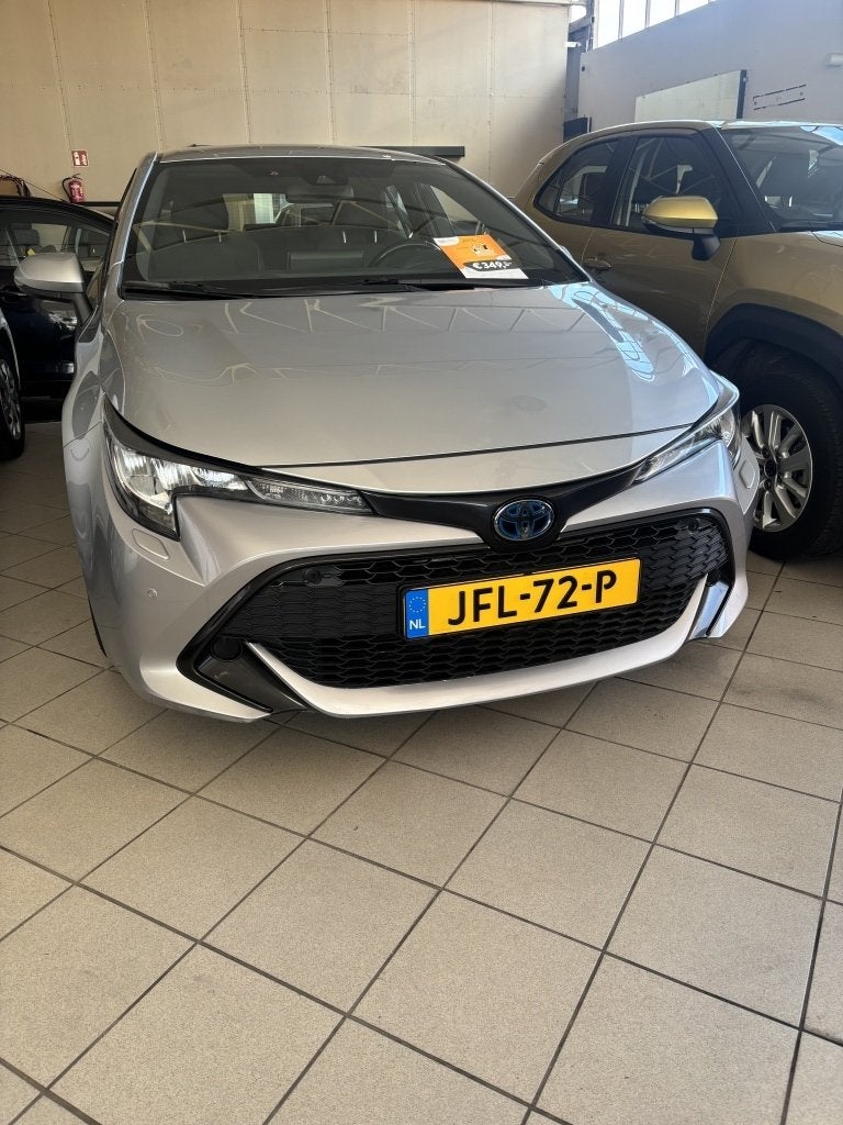 Toyota Corolla 1.8 Hybrid Active (bj 2022, automaat), Auto's, Automaat, 450 kg, Gebruikt, 4 cilinders