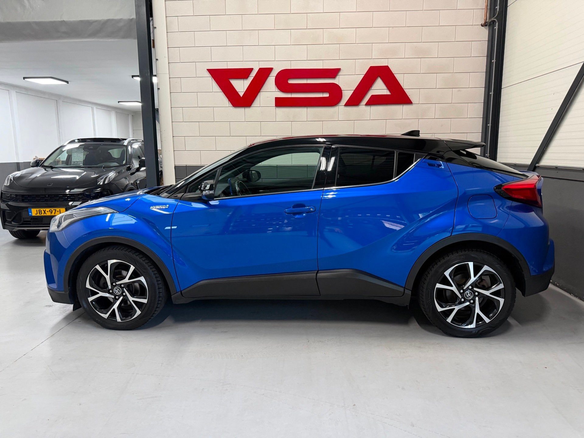 Toyota C-HR 1.8 Hybrid Bi-Tone|Camera|hybrid|Cruise|Navi|PDC, Auto's, 4 cilinders, Met garantie (alle), Blauw, 98 pk