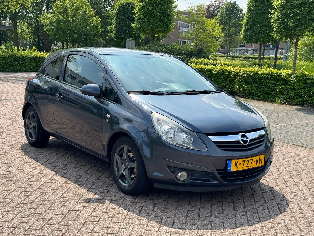 Opel Corsa 1.2 Ecoflex 51KW 3D 2010 Grijs, Voorwielaandrijving, Metallic lak, 40 €/maand, 4 cilinders