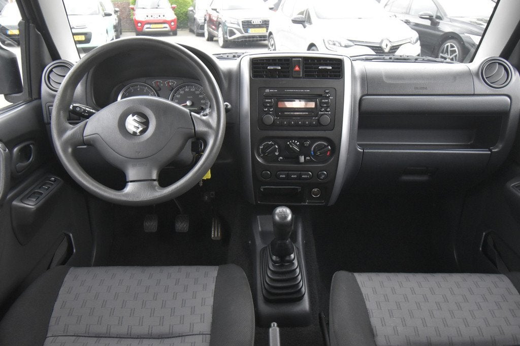 Suzuki Jimny 1.3 Exclusive 4WD , TREKHAAK , AIRCO , LMV15 ,, Auto's, Suzuki, Zwart, 4 stoelen, Bedrijf, Vierwielaandrijving
