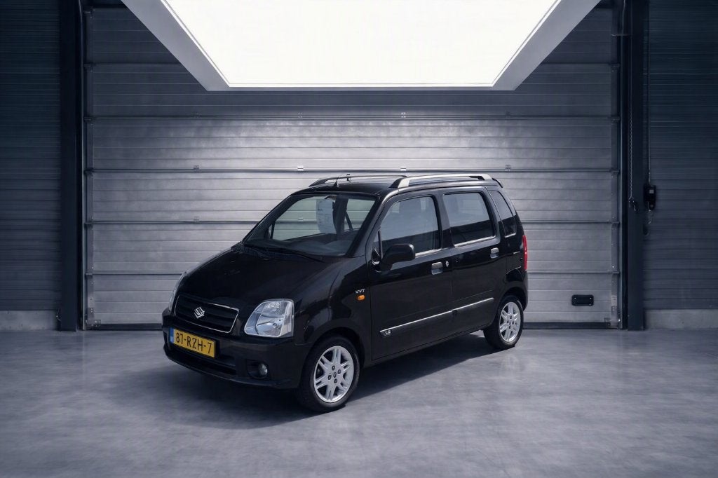 Suzuki Wagon R+ 1.3 AUTOMAAT 2005, Auto's, Stof, 40 €/maand, Zwart, Wagon R+