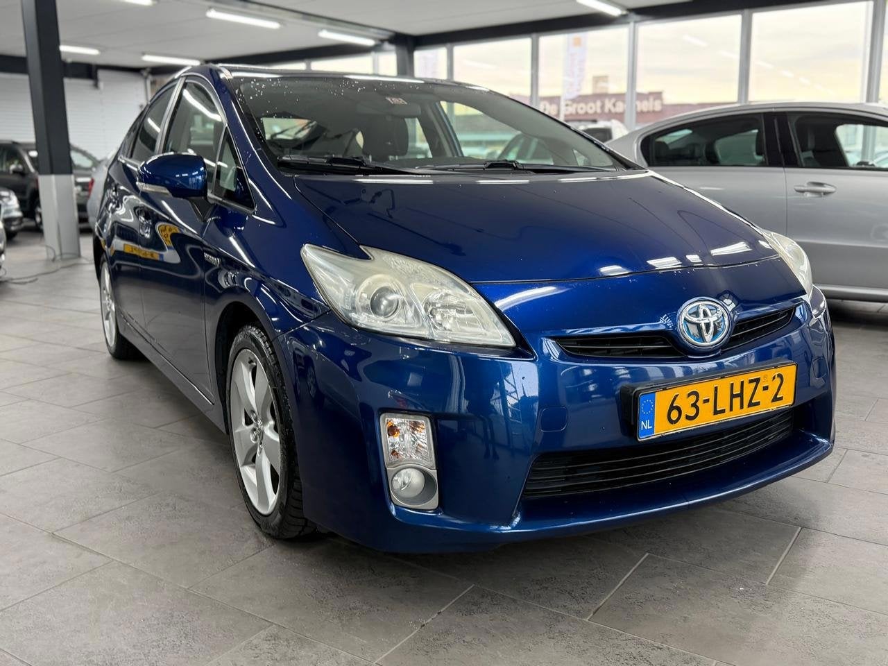 Toyota Prius 1.8 Aspiration 1-eigenaar clima cruise control, Auto's, Stof, Gebruikt, 4 cilinders, Blauw