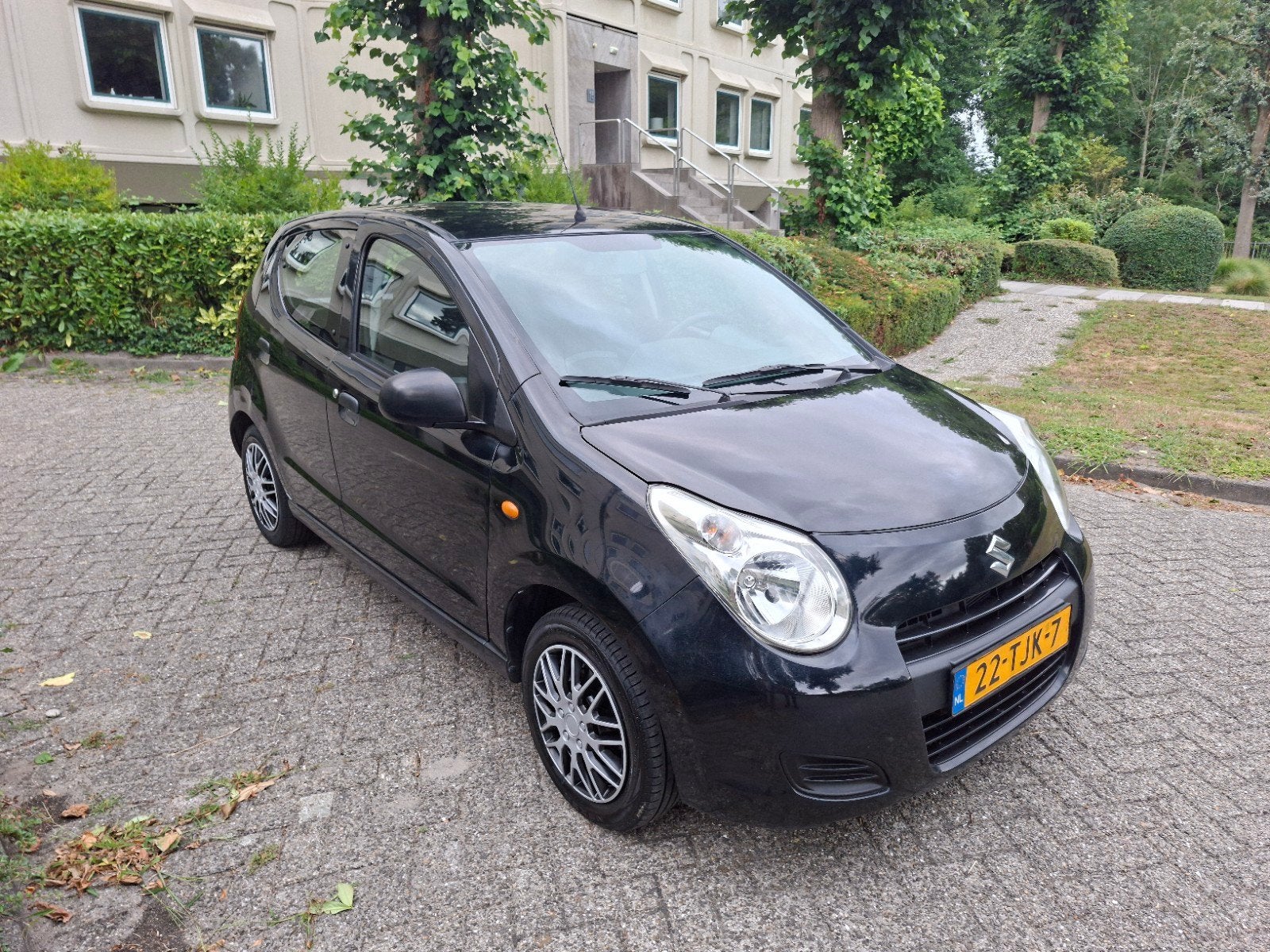 Zwarte Suzuki Alto Comfort Plus 2012–1e eigenaar–103.631 km, Auto's, Voorwielaandrijving, Stof, Handgeschakeld, Grijs