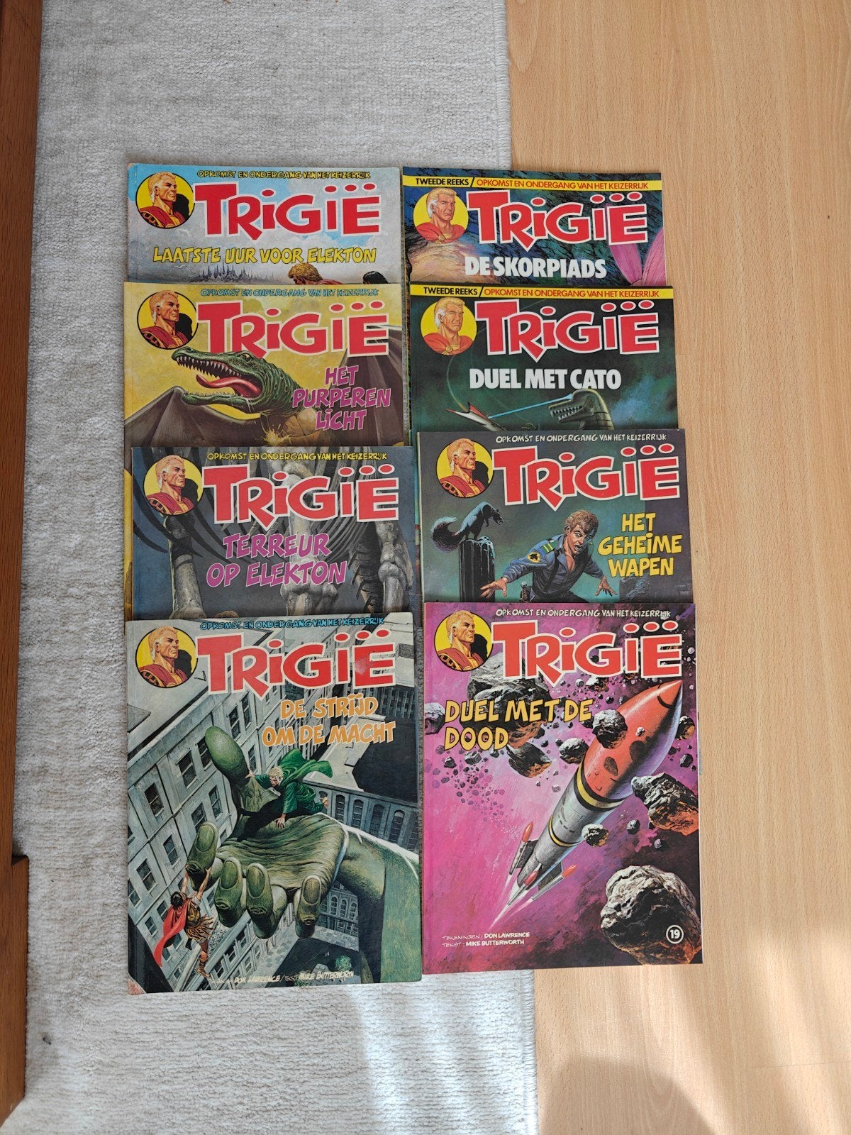 8 Trigië stripboeken: 7, 11, 14, 15, 19, 21, 24 en 27, Meerdere stripboeken, Ophalen of Verzenden, Gelezen