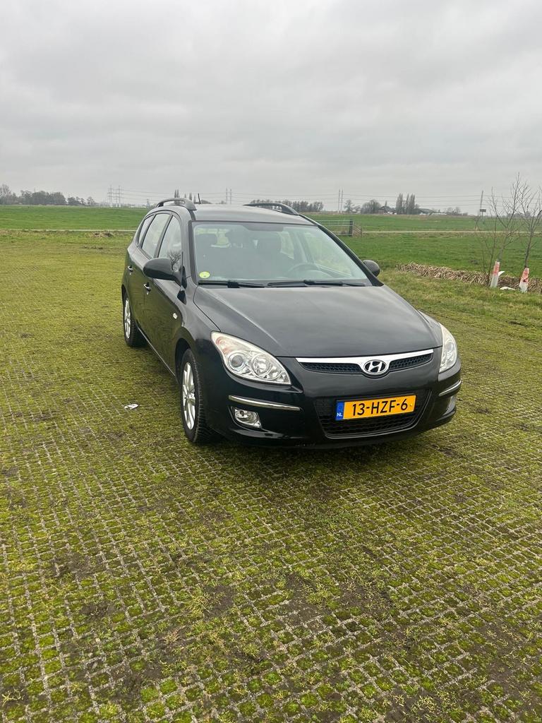 Hyundai i30 1.6 I Cvvt Crosswagon 2009 Zwart, Auto's, Voorwielaandrijving, 1591 cc, 4 cilinders, Zwart