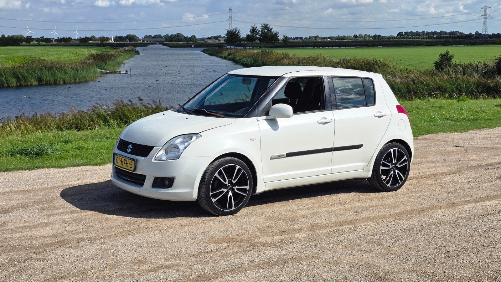 Suzuki Swift 1.3 5DRS NAP / APK / Clima / Top Auto /, Voorwielaandrijving, Stof, 40 €/maand, Zwart