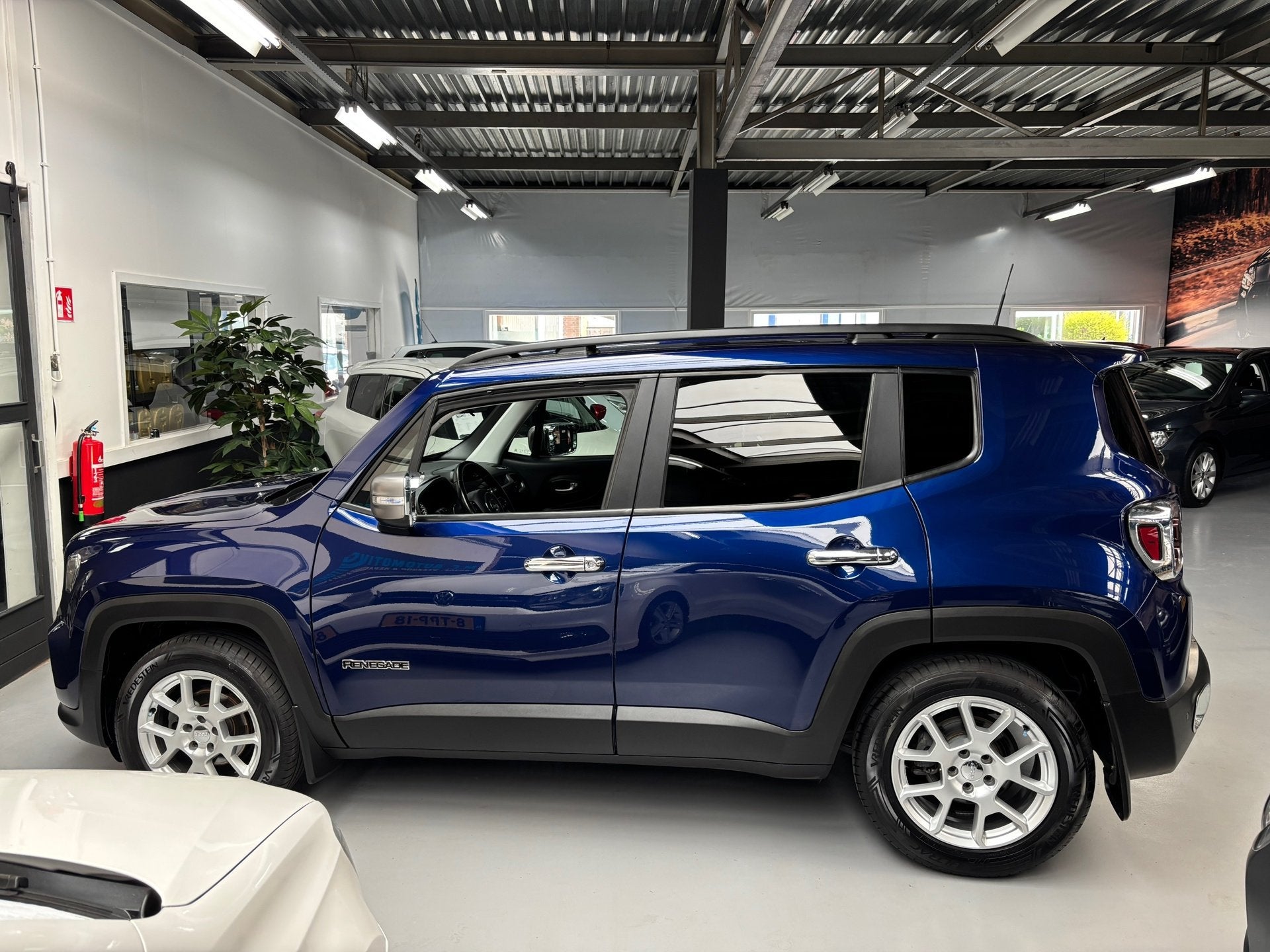 Jeep Renegade 1.0T-e Limited / Navigatie, Auto's, Jeep, Voorwielaandrijving, Stof, Met garantie (alle), Blauw