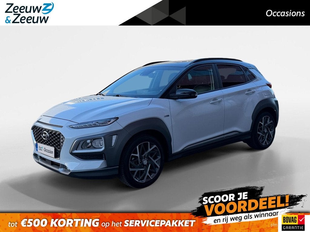 Hyundai Kona 1.6 GDI HEV Premium 105PK AUTOMAAT WK DEAL €, Auto's, Hyundai, 12 maanden, Gebruikt, Euro 6, Wit